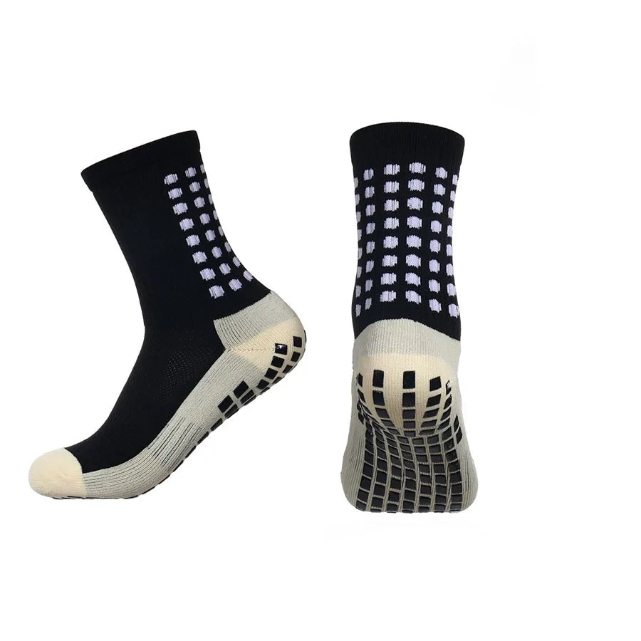 Close-up of anti-slip grip nodes on sock sole showing traction technology