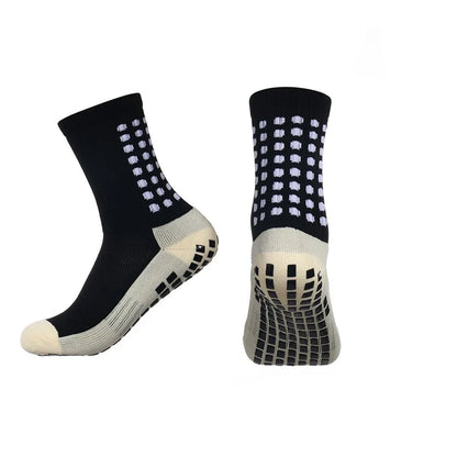 Close-up of anti-slip grip nodes on sock sole showing traction technology