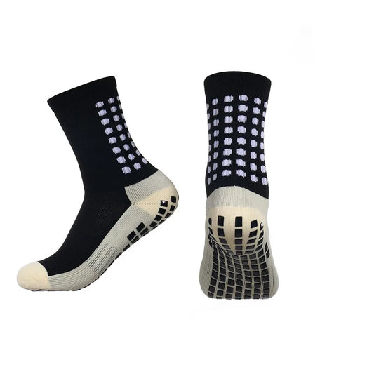 Close-up of anti-slip grip nodes on sock sole showing traction technology