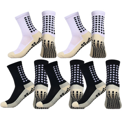 Crew-cut grip socks displayed on neutral background showing full length and grip pattern on sole